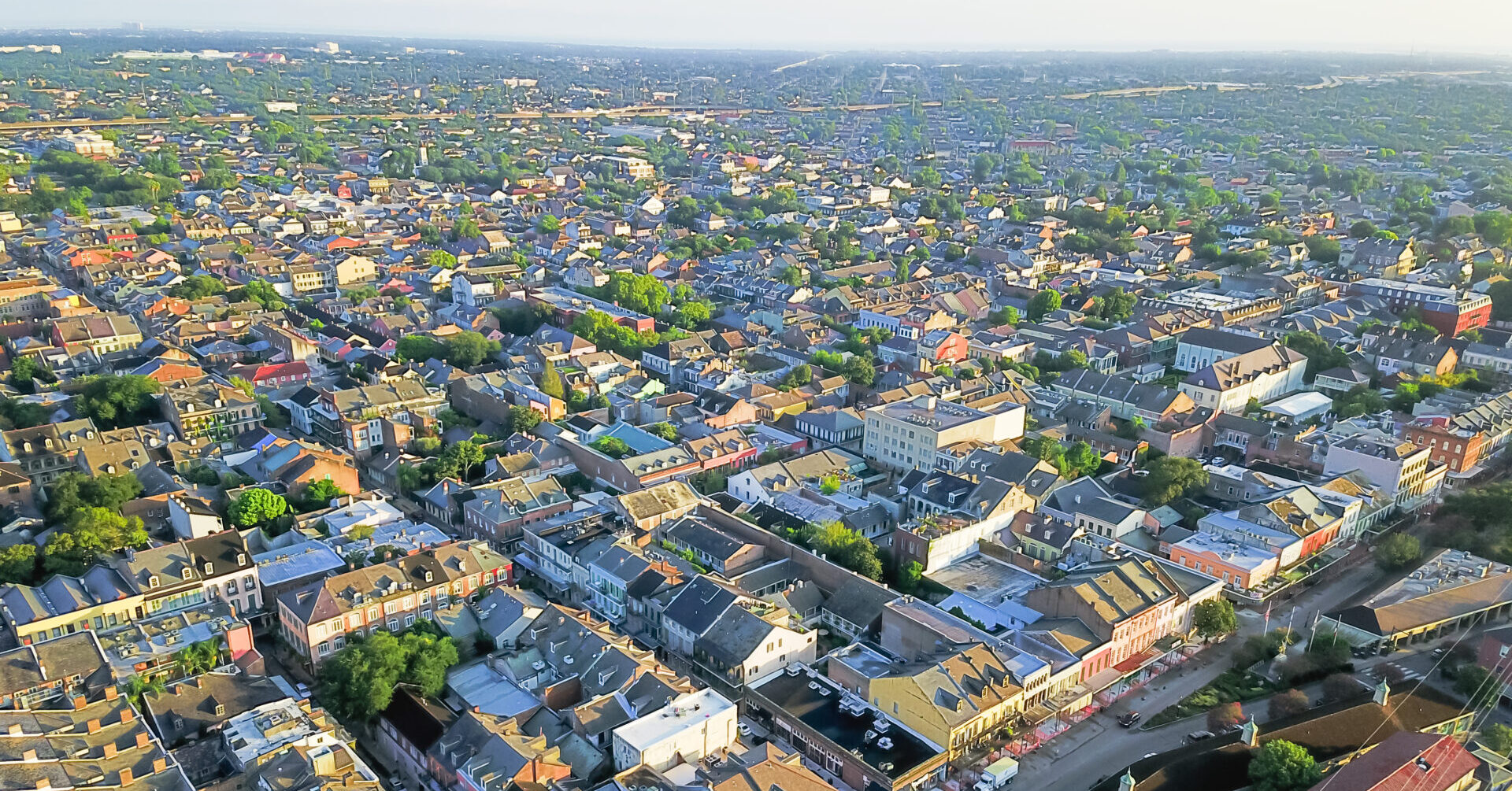 Aerial view French Quarter with extant historical buildings from 19th century. The historic district section of the city of New Orleans, Louisiana, USA, morning warm light.